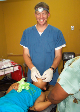 Dr. Keith VanTassell, pedodontist, performs work on a Guatemalan child