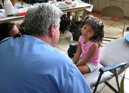 Dr. Richard Call and 5-year-old Guatemalan girl